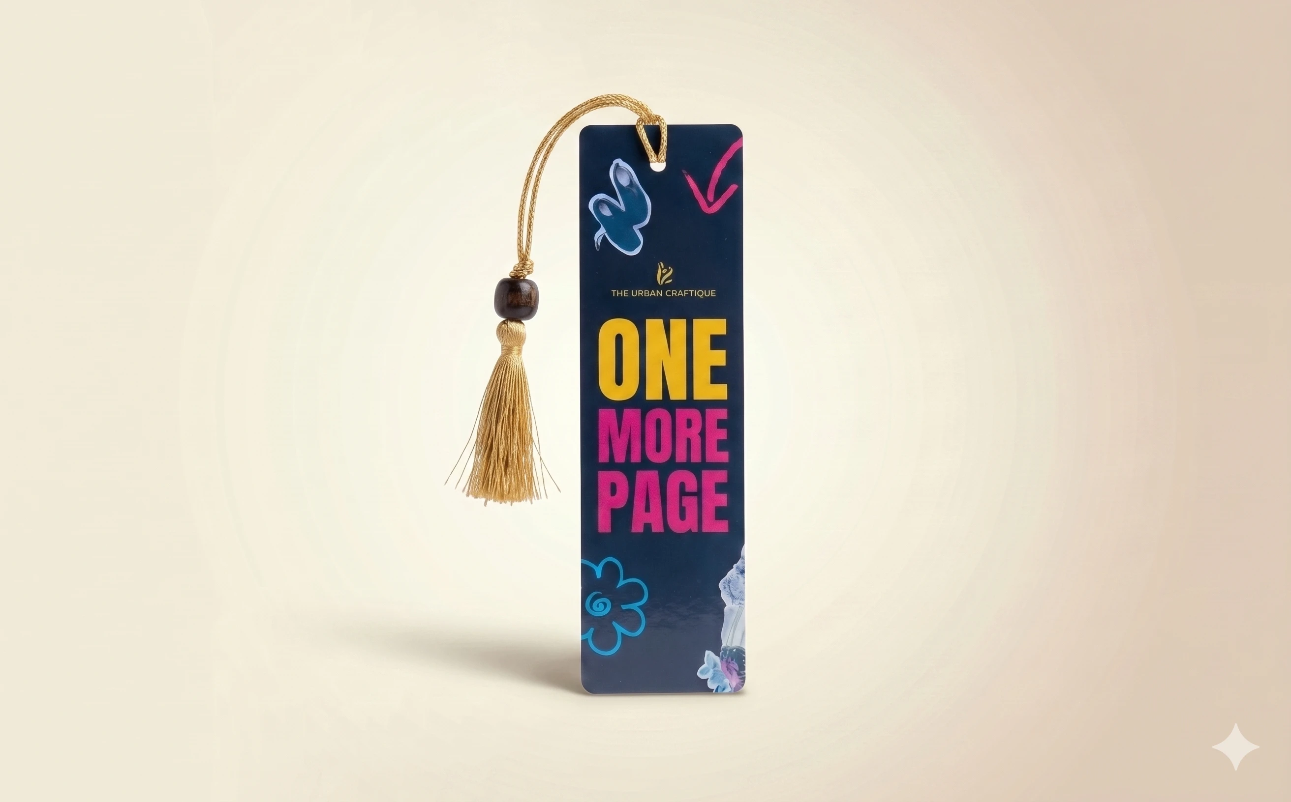 THE URBAN CRAFTIQUE Handcrafted "One More Page" Premium Bookmark with Elegant Gold Tassel and Wooden Bead – Perfect for Book Lovers, Students, and Gifting A+ content image